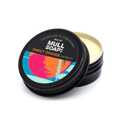 sweet orange lip balm in a black tin with colourful label. vegan lip balm handmade in Tobermory by the Isle of Mull soap co. 